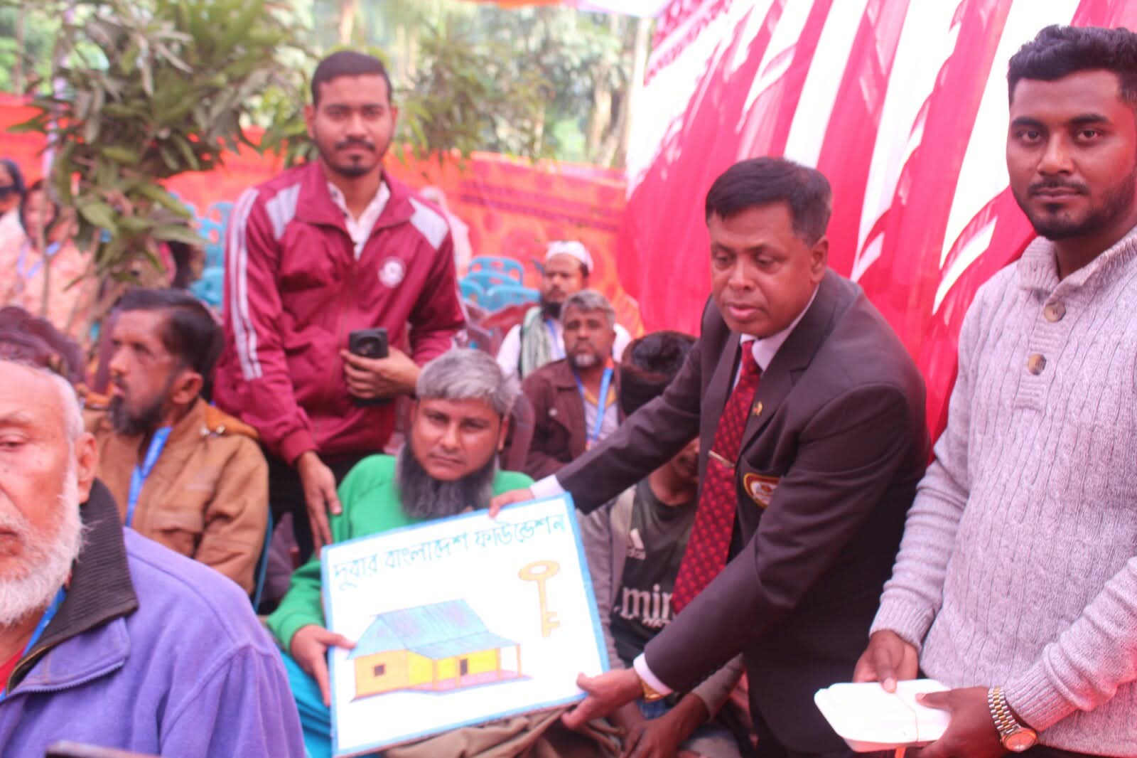 দুর্বার বাংলাদেশ ফাউন্ডেশন কর্তৃক আয়োজিত গৃহহীণদের জন্য নির্মিত ঘরের চাবি হস্তান্তর ও শীত বস্ত্র বিতরণ ২০২৫